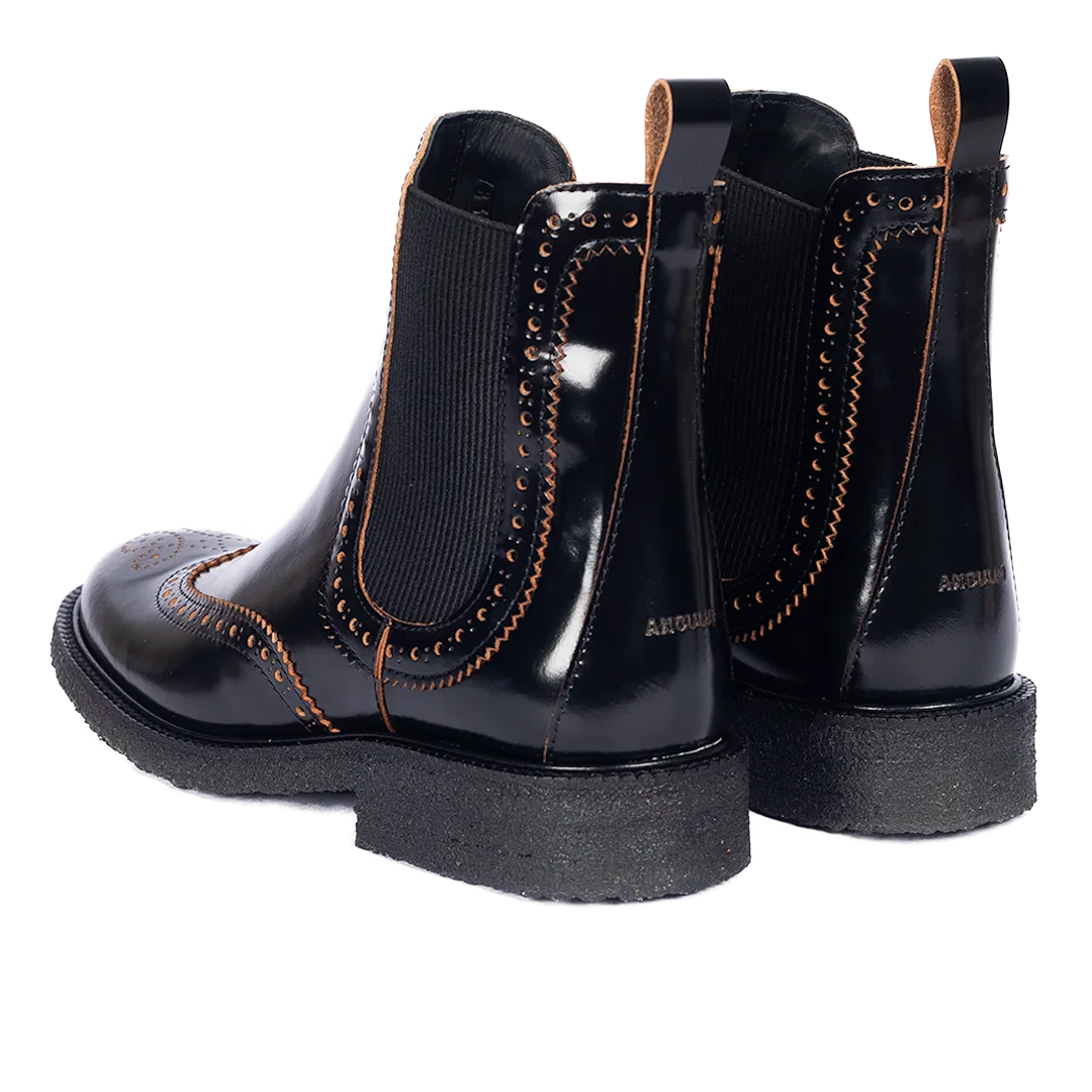 Boot with decorative brogue pattern