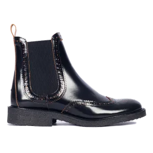 Boot with decorative brogue pattern