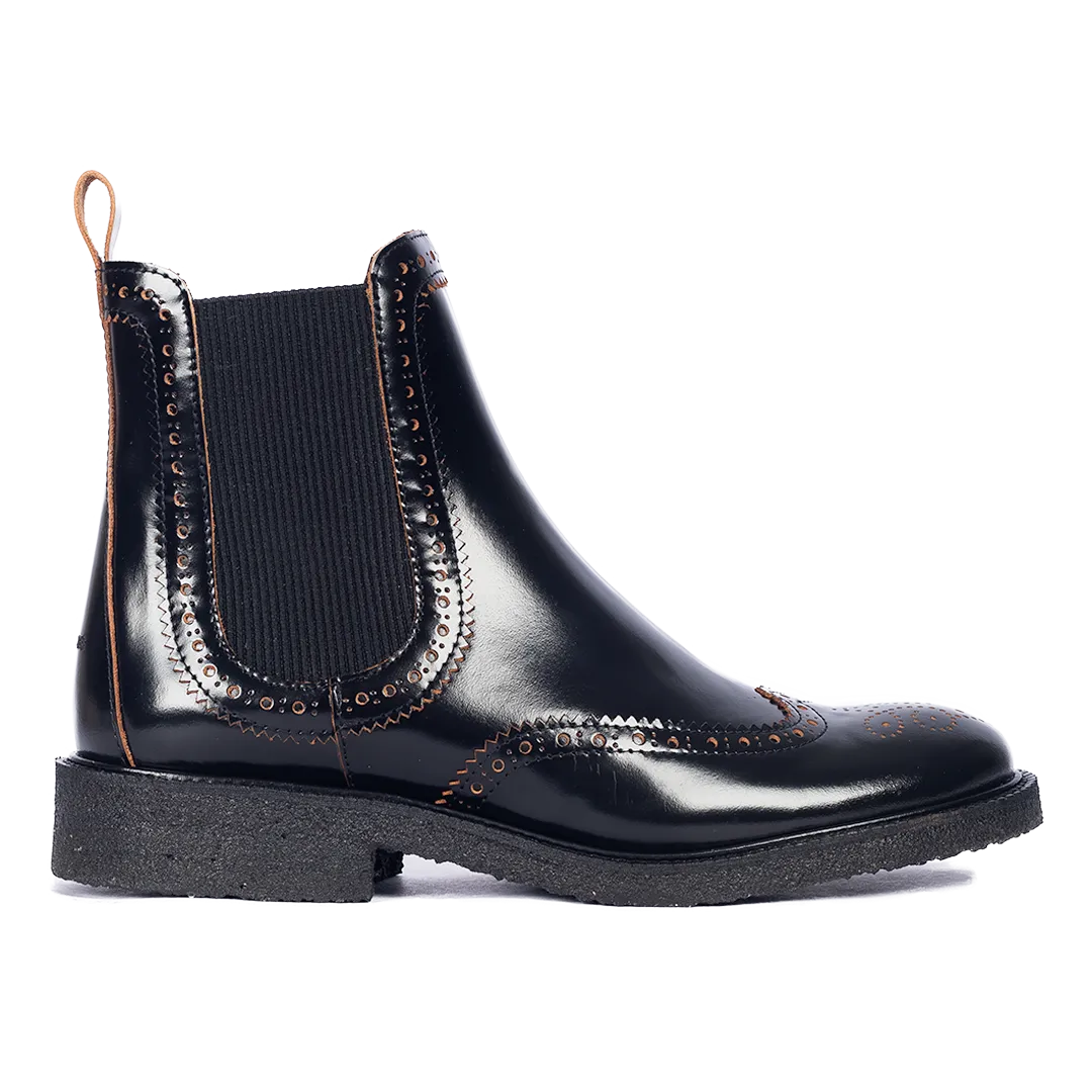 Boot with decorative brogue pattern